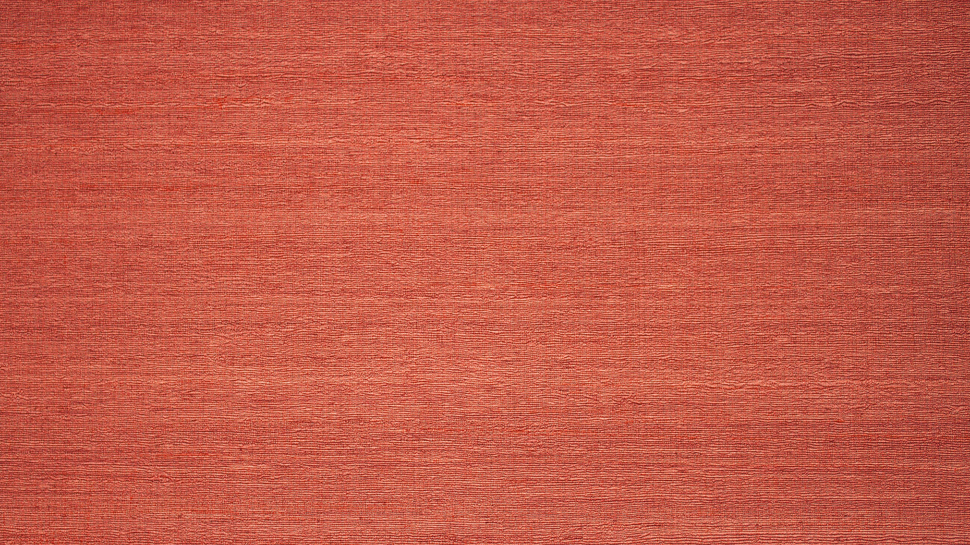 Rote strukturierte Wandoberfläche